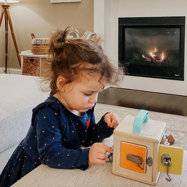 Child opening The Lockbox from The Realist Play Kit